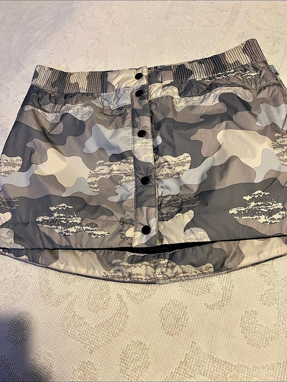 Stio Camo insulated skirt in a variety of gray color.